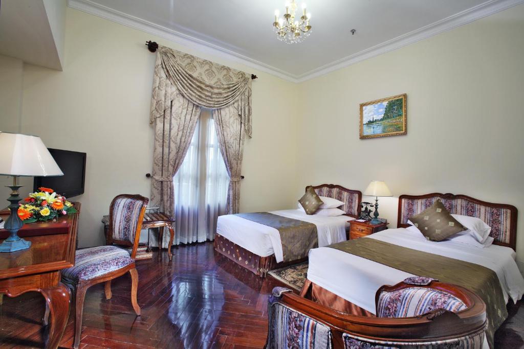 Двухместный (Представительский двухместный номер «Гранд» с 2 отдельными кроватями) отеля Grand Hotel Saigon, Хошимин