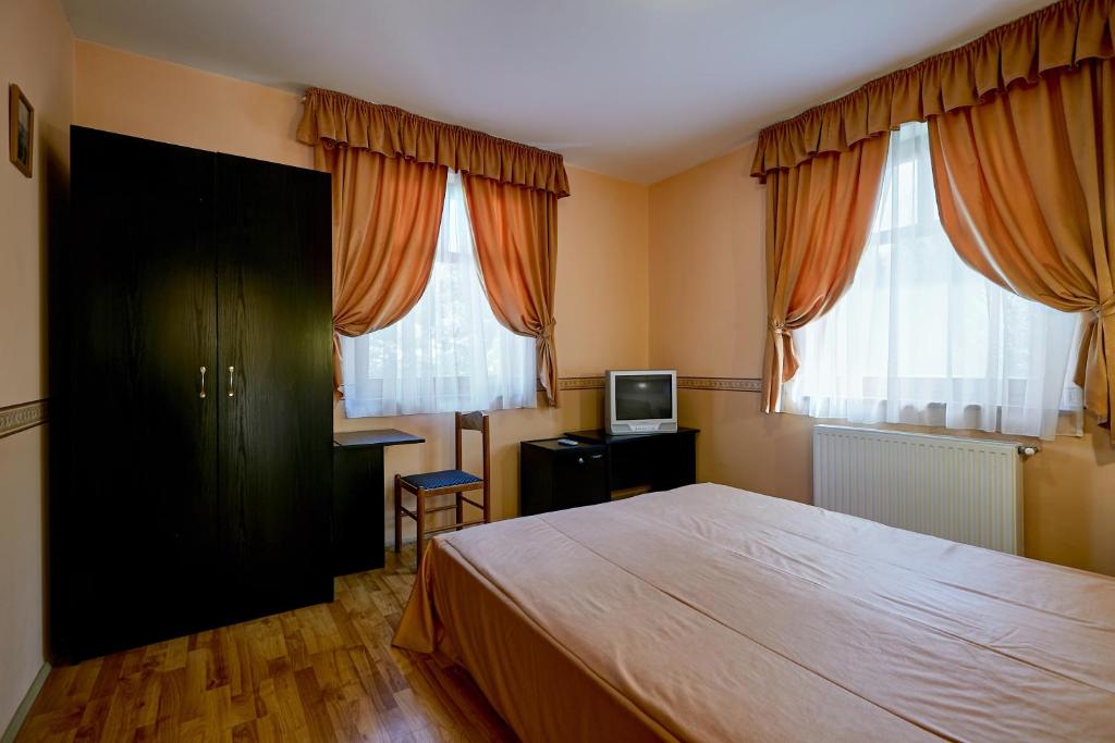 Двухместный (Двухместный номер с 1 кроватью или 2 отдельными кроватями) отеля Pihenőkereszt Panzió, Шопрон