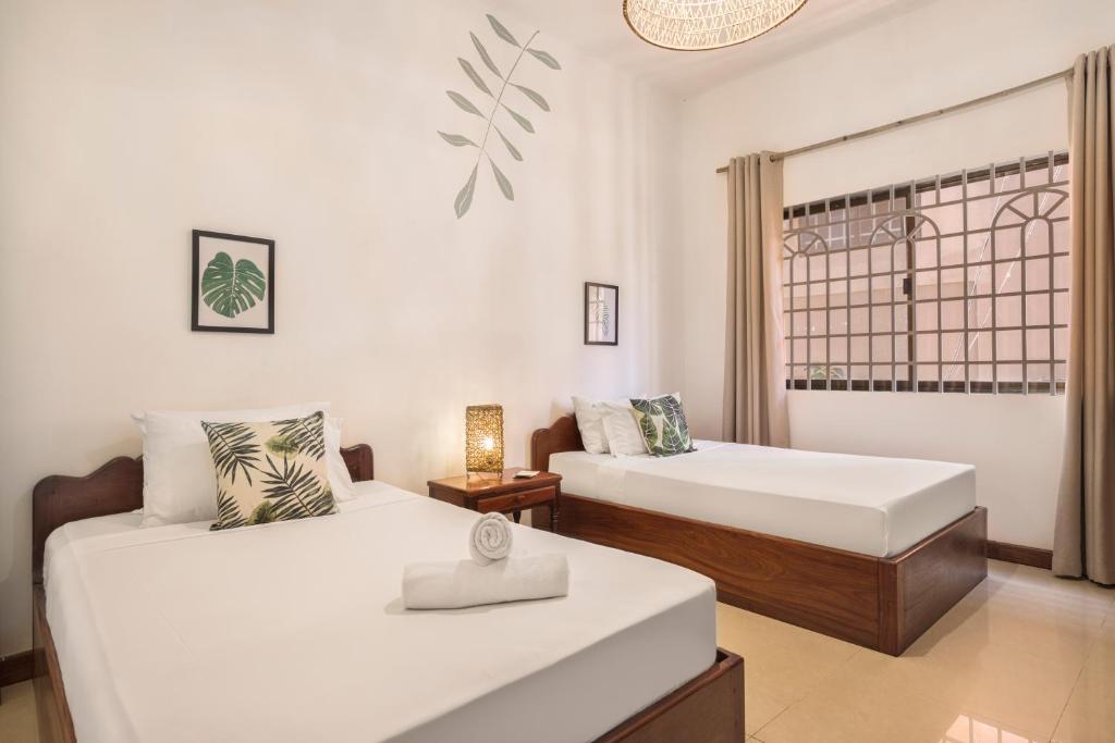 Двухместный (Двухместный номер с 2 отдельными кроватями) отеля Babel Siem Reap Guesthouse, Сием Рип