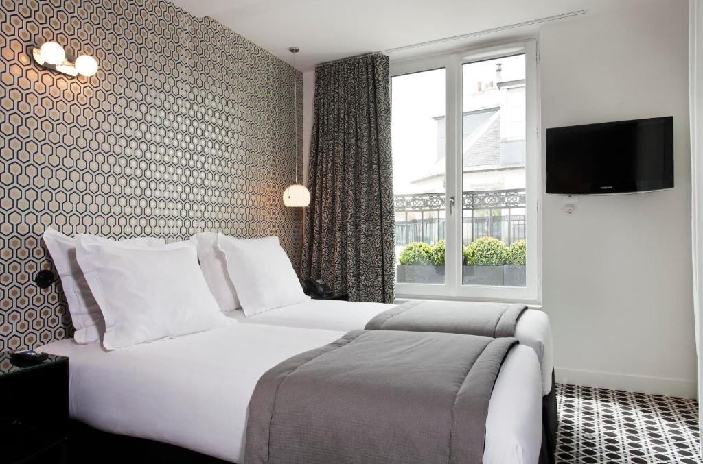 Двухместный (Двухместный номер с 2 отдельными кроватями) отеля Hôtel Emile, Париж