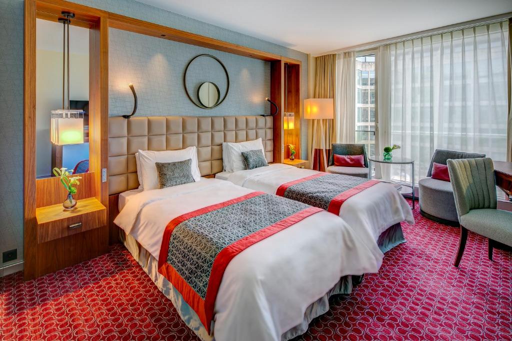 Двухместный (Двухместный номер Fairmont с 2 отдельными кроватями и видом во внутренний двор) отеля Grand Hotel Kempinski Geneva, Женева