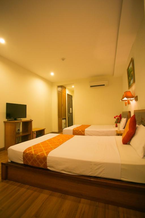 Двухместный (Двухместный номер Делюкс с 2 двуспальными кроватями) отеля Golden Sea Hotel, Нячанг