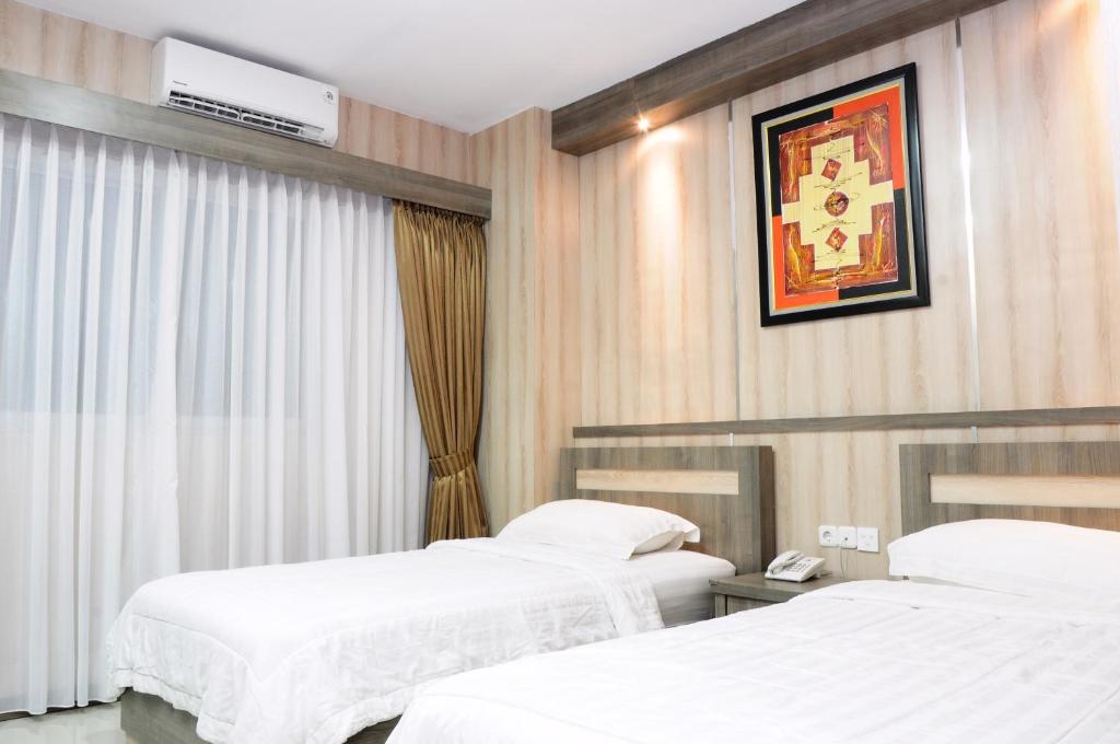 Двухместный (Двухместный номер Делюкс с 2 отдельными кроватями) отеля Graha SUMSEL, Джакарта