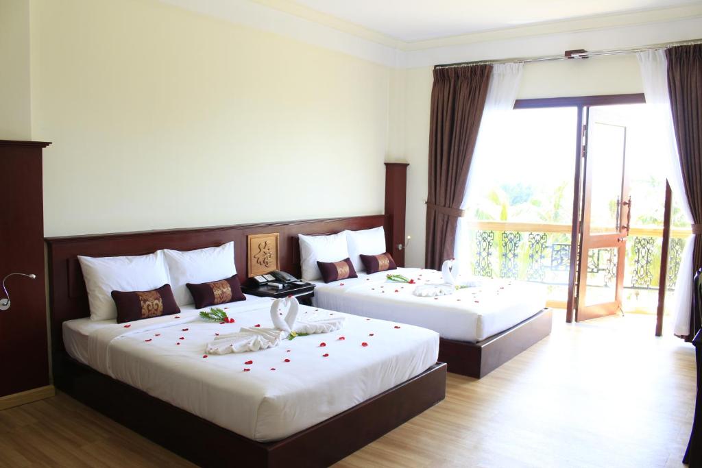 Четырехместный (Номер Делюкс с 2 кроватями размера «queen-size») курортного отеля Ca Ty Muine Resort, Фантхьет