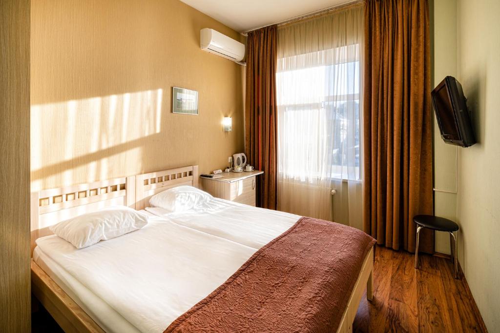 Двухместный (Стандартный двухместный номер с 1 кроватью или 2 отдельными кроватями) отеля Biplan Hotel, Даугавпилс