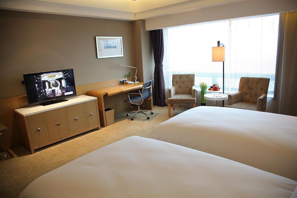 Двухместный (Специальное предложение - двухместный номер Делюкс с 2 отдельными кроватями) отеля Shanghai Hongqiao Airport Hotel - Air China, Шанхай