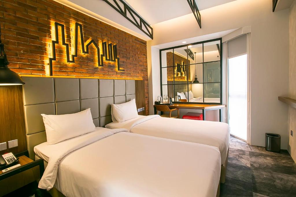 Двухместный (Улучшенный двухместный номер с 2 отдельными кроватями) отеля Posto Dormire Hotel, Джакарта