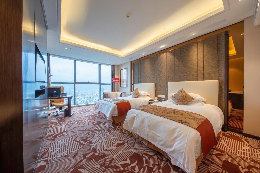 Двухместный (Executive Deluxe Twin Room with River View) отеля Yiwu Shangcheng Hotel, Иу