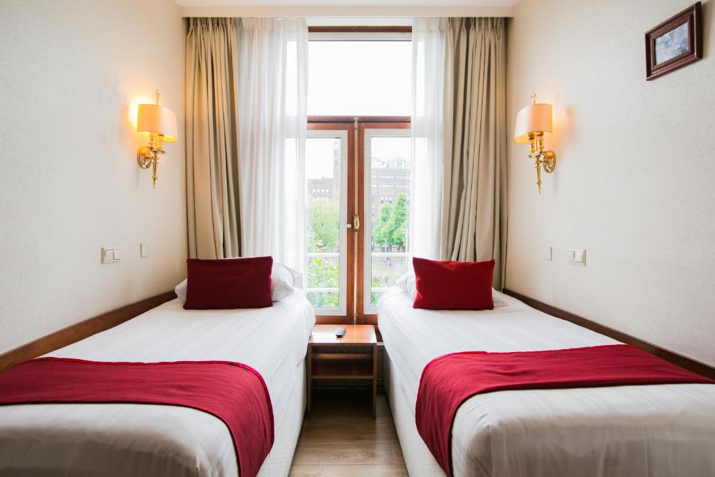Двухместный (Двухместный номер с 2 отдельными кроватями (общая ванная комната)) отеля Hotel Atlanta, Амстердам