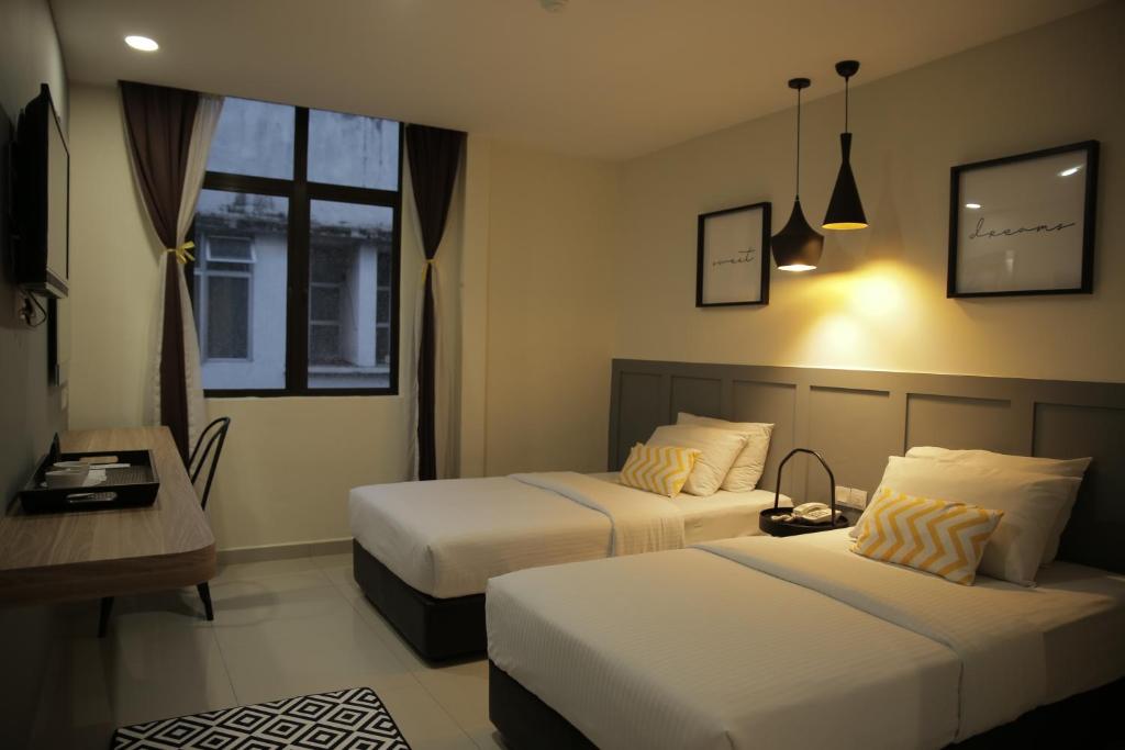 Двухместный (Улучшенный двухместный номер с 2 отдельными кроватями) отеля Mixx Hotel, Куала-Лумпур
