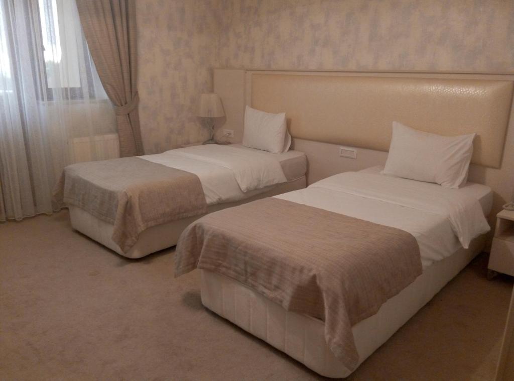 Двухместный (Стандартный двухместный номер с 2 отдельными кроватями) отеля Kaspia Yeddi Gozel Hotel, Габала