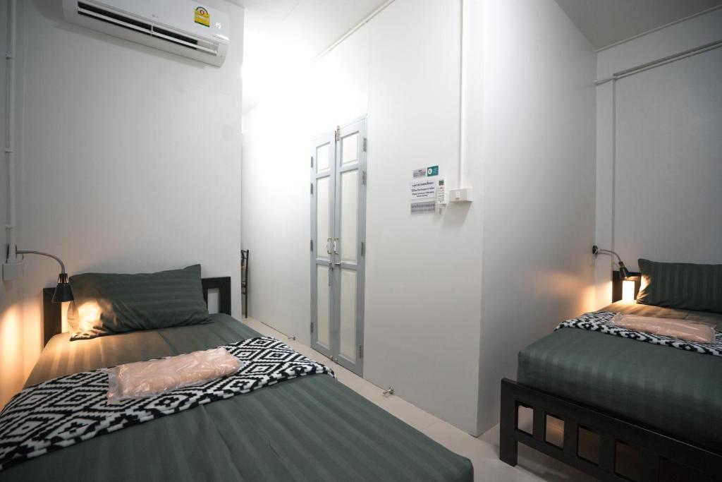 Двухместный (Бюджетный двухместный номер с 2 отдельными кроватями) хостела Dhub Hostel Donmueng, Бангкок