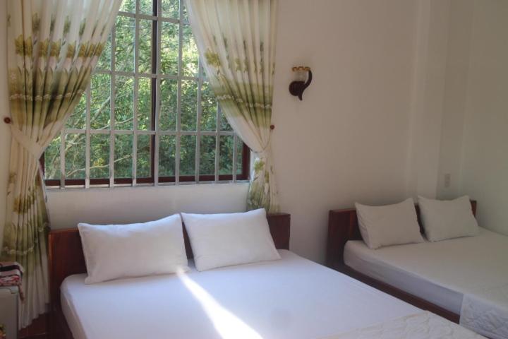 Четырехместный (Номер Делюкс с 2 кроватями размера «queen-size») отеля Gecko Guest House, Дуонг-Донг