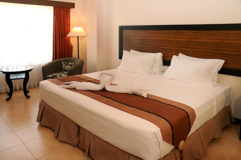 Двухместный (Двухместный номер Делюкс с 1 кроватью или 2 отдельными кроватями) отеля Hotel Tropika, Давао