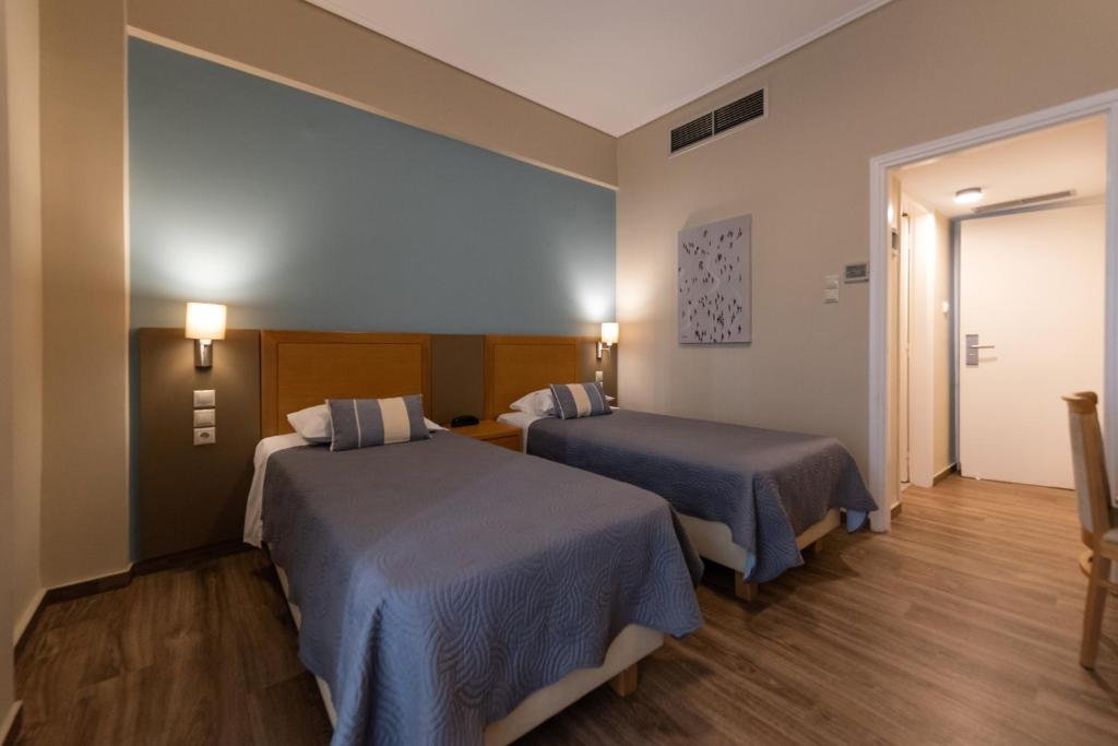 Двухместный (Стандартный двухместный номер с 1 кроватью или 2 отдельными кроватями) отеля Hotel Ostria, Каламата