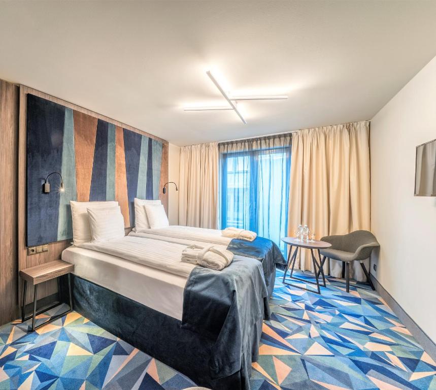 Двухместный (Стандартный двухместный номер с 1 кроватью или 2 отдельными кроватями) отеля Wellton Riverside SPA Hotel, Рига