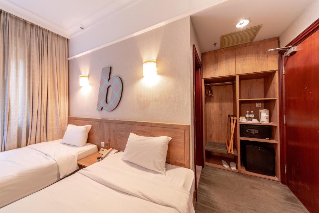 Двухместный (Двухместный номер Делюкс с 2 отдельными кроватями) отеля Hotel Bencoolen Singapore, Сингапур (город)
