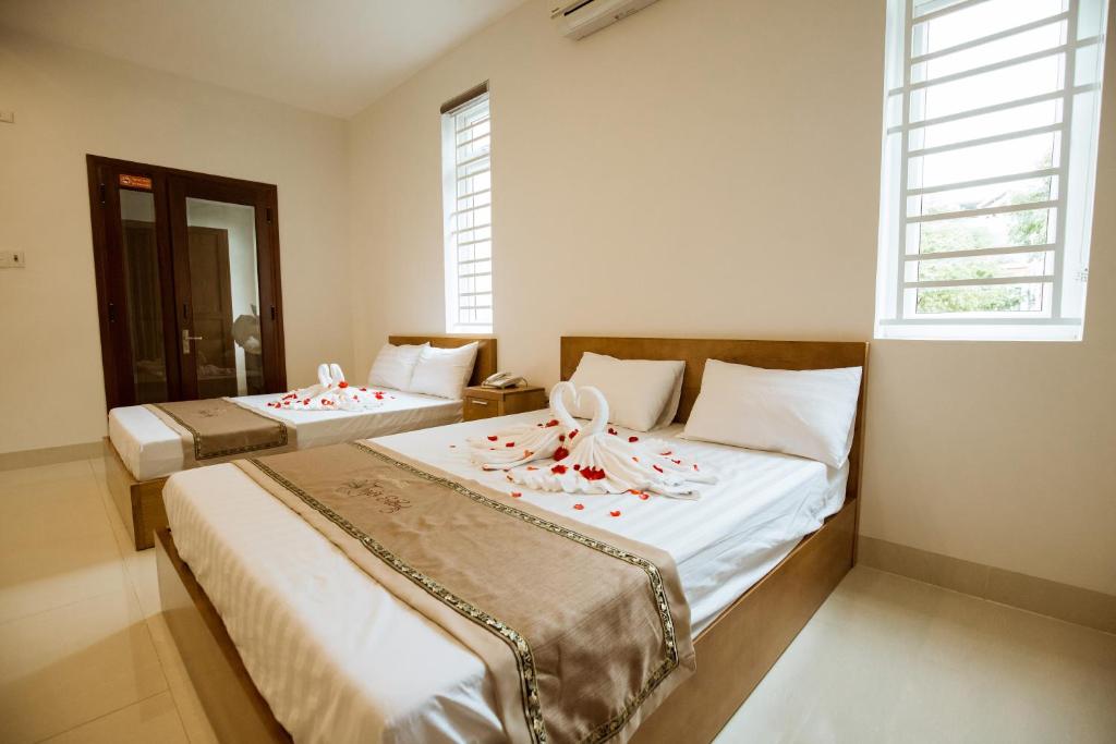 Двухместный (Двухместный номер Делюкс с 1 кроватью или 2 отдельными кроватями и гидромассажной ванной) отеля Tuyet Suong Villa Hotel, Куангнгай