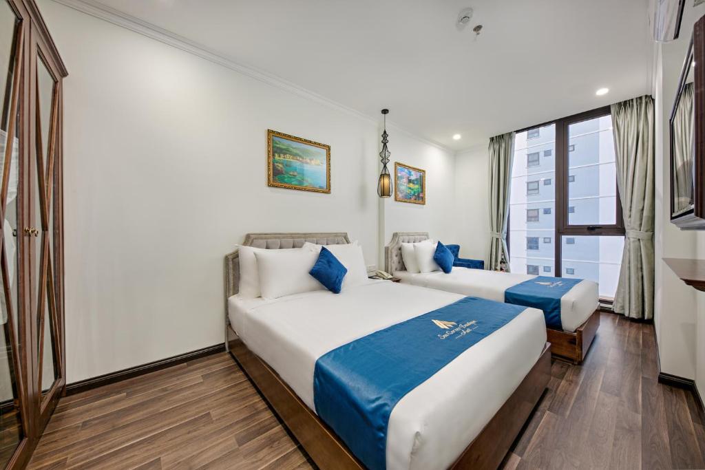 Семейный (Двухместный номер Делюкс с 2 отдельными кроватями и частичным видом на море) отеля Sea Corner Boutique Hotel & Apartment, Дананг