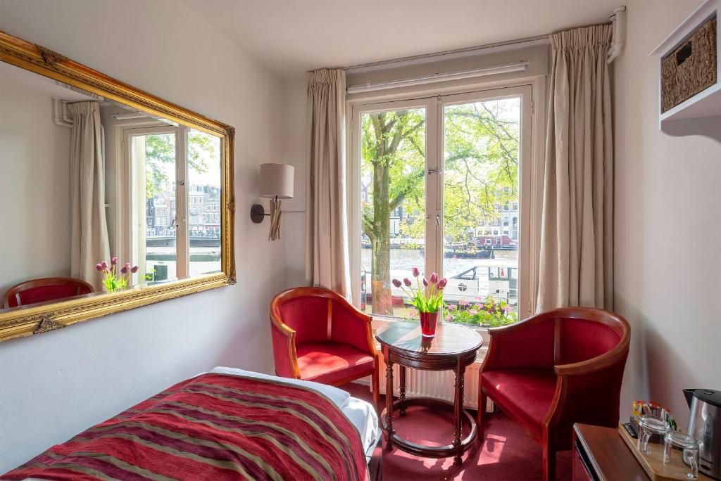 Трехместный (Трехместный номер с видом на канал) отеля Amsterdam House Hotel Eureka, Амстердам