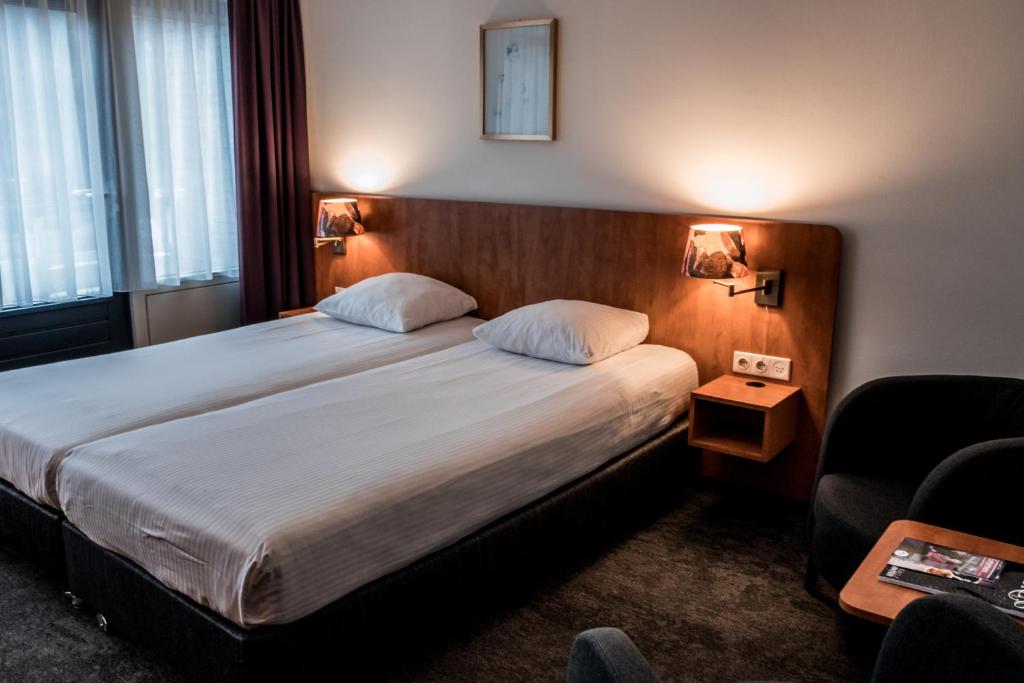 Двухместный (Бюджетный двухместный номер с 2 отдельными кроватями) отеля Hotel ten Cate Emmen, Гронинген