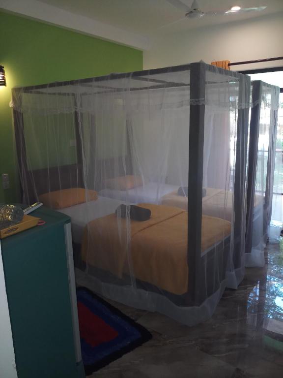 Двухместный (Стандартный двухместный номер с 1 двуспальной или 2 отдельными кроватями, вид на бассейн) курортного отеля Jagabay Resort & Restaurant, Велигама