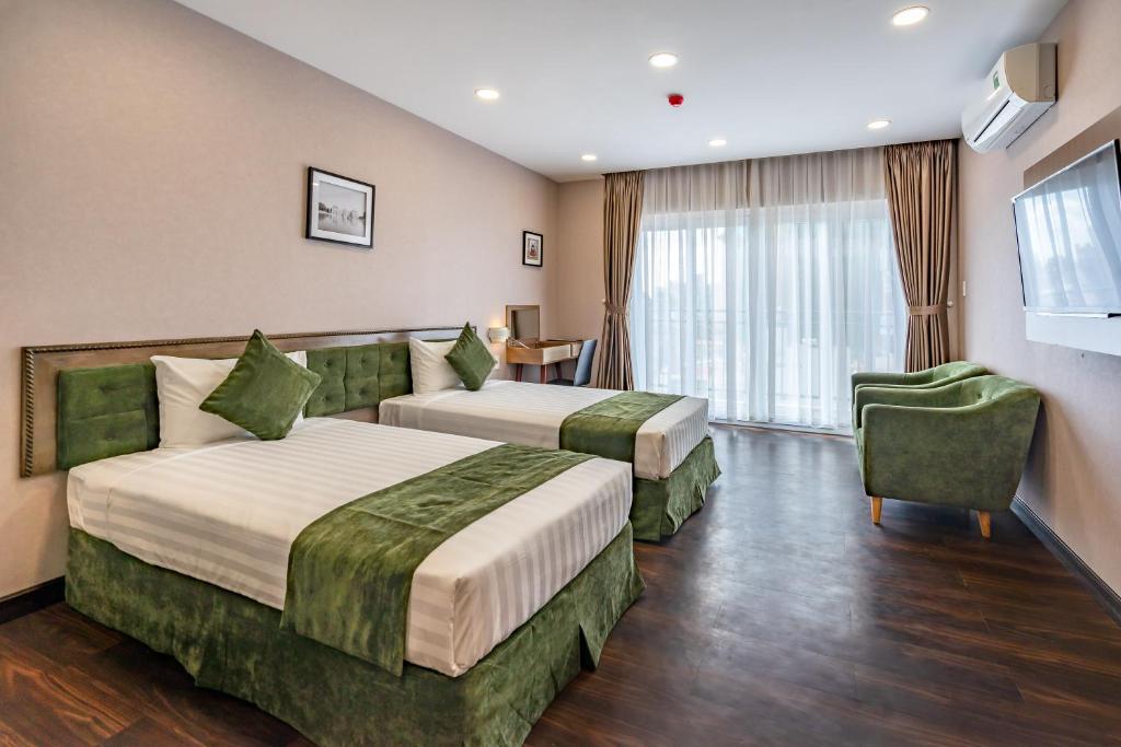 Двухместный (Двухместный номер Делюкс с 2 отдельными кроватями) отеля Emerald Central, Хошимин