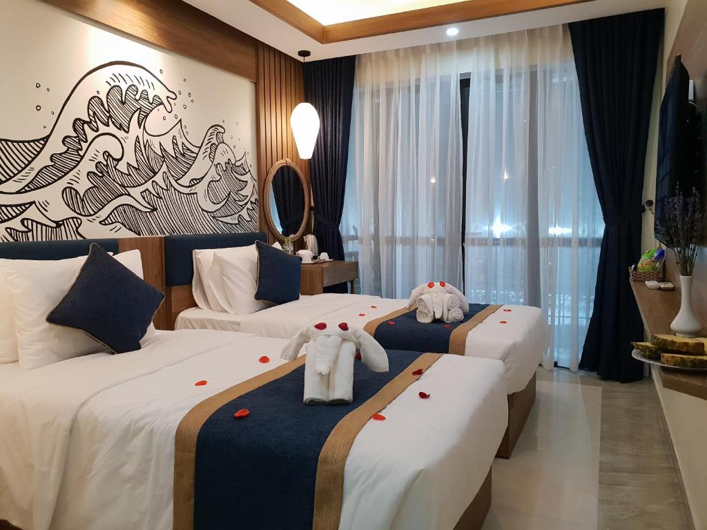 Двухместный (Двухместный номер Делюкс с 2 отдельными кроватями и балконом) отеля Southern Hotel Hoi An, Хойан