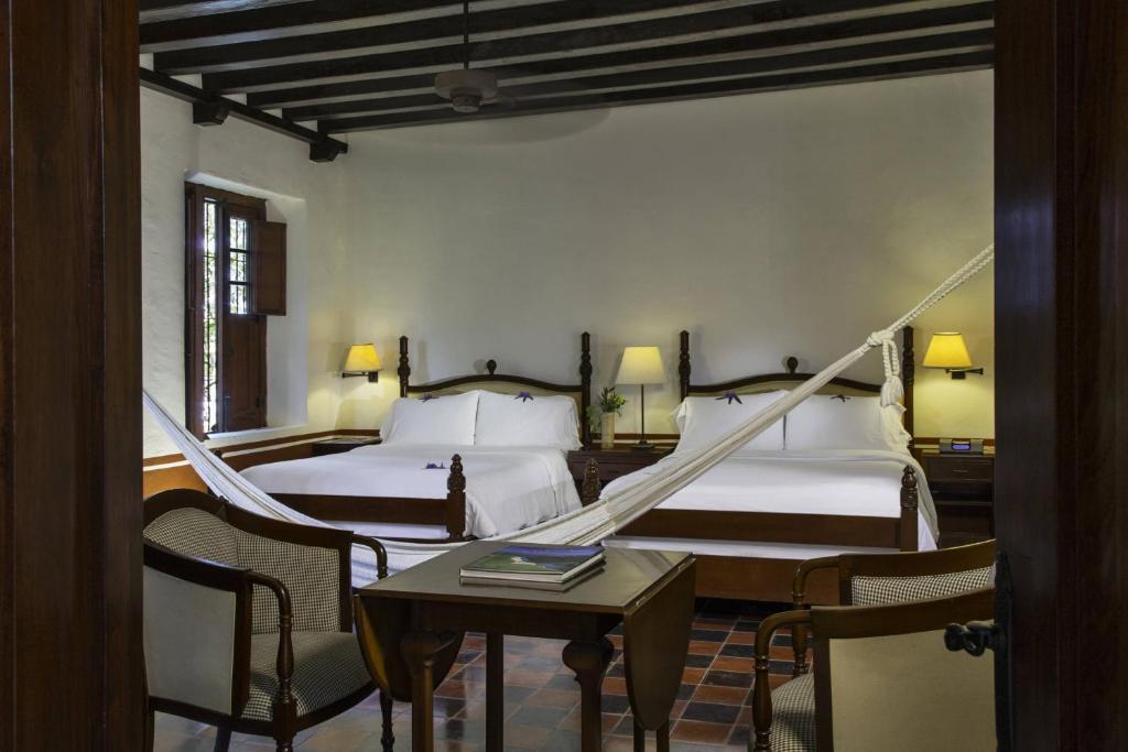 Двухместный (1 Bedroom Larger Suite, 2 Queen, Garden view) отеля Hacienda Puerta Campeche a Luxury Collection Hotel, Кампече