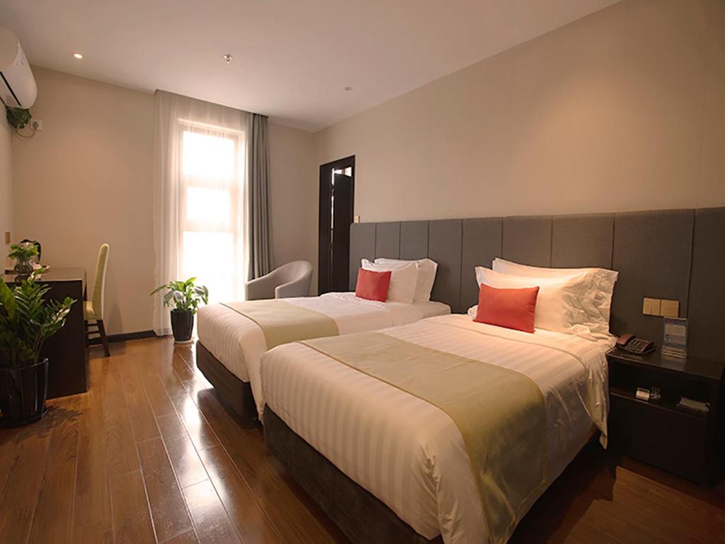 Двухместный (Двухместный номер Делюкс с 1 кроватью или 2 отдельными кроватями) отеля Joyful Star Hotel Pudong Airport Chenyang, Шанхай