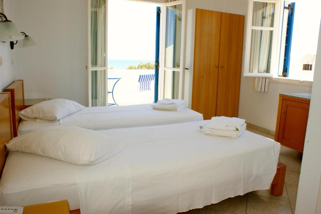 Двухместный (Двухместный номер с 1 кроватью или 2 отдельными кроватями и видом на море) отеля Blue Bay Villas, Камари