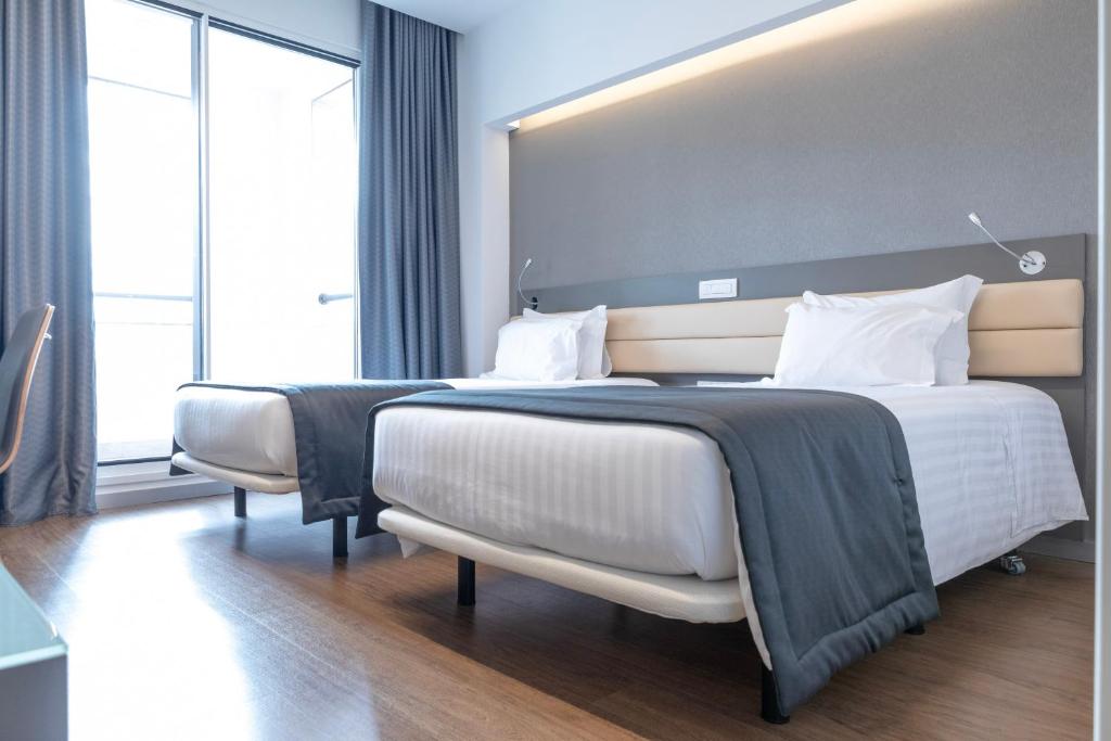 Двухместный (Улучшенный двухместный номер с 2 отдельными кроватями) отеля Hotel Alif Campo Pequeno, Лиссабон
