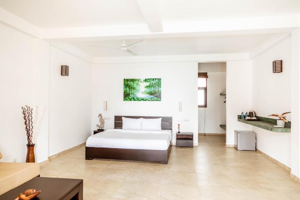 Двухместный (Двухместный номер Делюкс с 1 кроватью или 2 отдельными кроватями) отеля Green Parrot Hotel, Тангалла