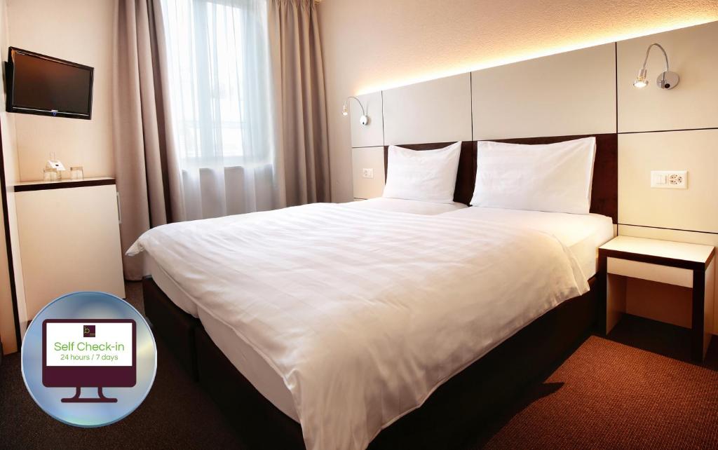 Двухместный (Двухместный номер «Смарт» с 1 кроватью или 2 отдельными кроватями) отеля b_smart motel, Базель