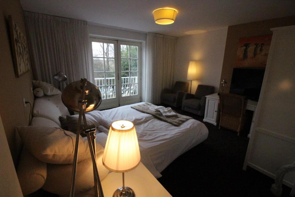 Двухместный (Номер Делюкс с кроватью размера «king-size») отеля Villa Wambacherbos, Венло