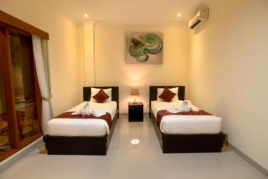 Двухместный (Двухместный номер с 2 отдельными кроватями и балконом) отеля Tom's Inn Pecatu, Улувату