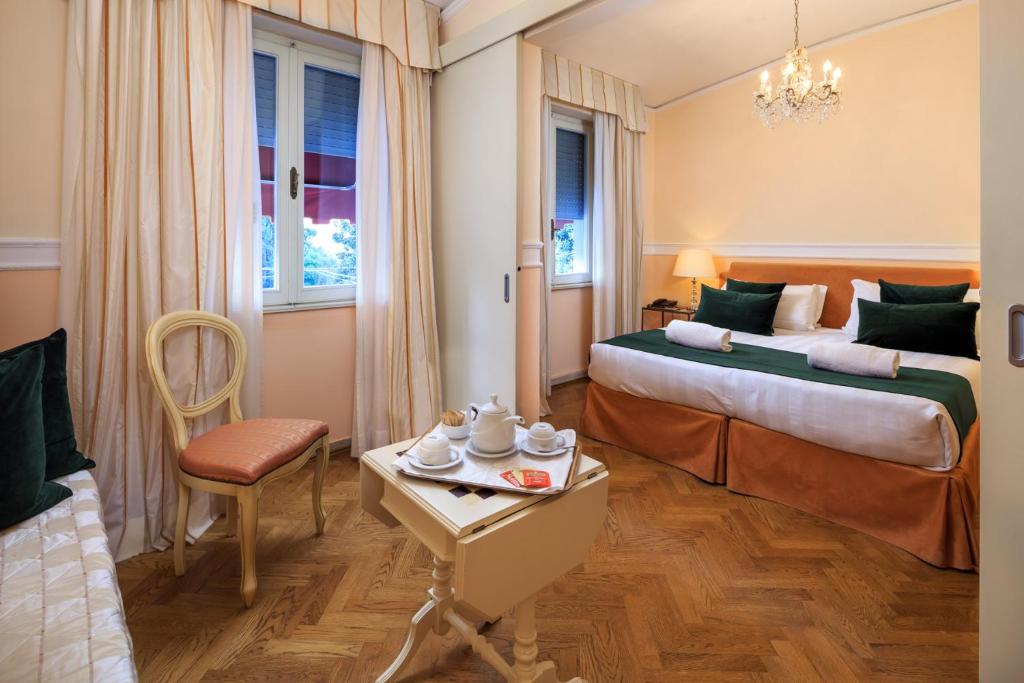 Трехместный (Трехместный номер с основными удобствами — Дополнительное здание) отеля Hotel Villa Carlotta, Флоренция