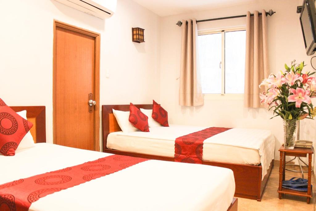 Двухместный (Улучшенный двухместный номер с 2 отдельными кроватями) отеля Sao Nam Hotel - Southern Star Hotel, Хошимин