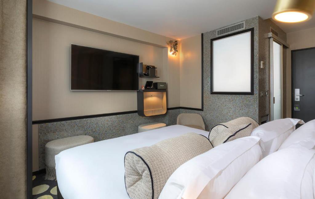 Двухместный (Улучшенный двухместный номер с 1 кроватью или 2 отдельными кроватями - Корпус 1) отеля Hotel Du Cadran, Париж