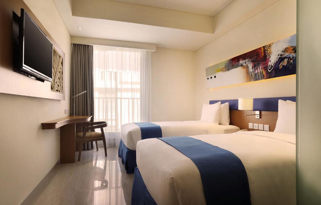 Двухместный (Улучшенный двухместный номер с 1 кроватью или 2 отдельными кроватями) отеля Zia Hotel Kuta, Кута