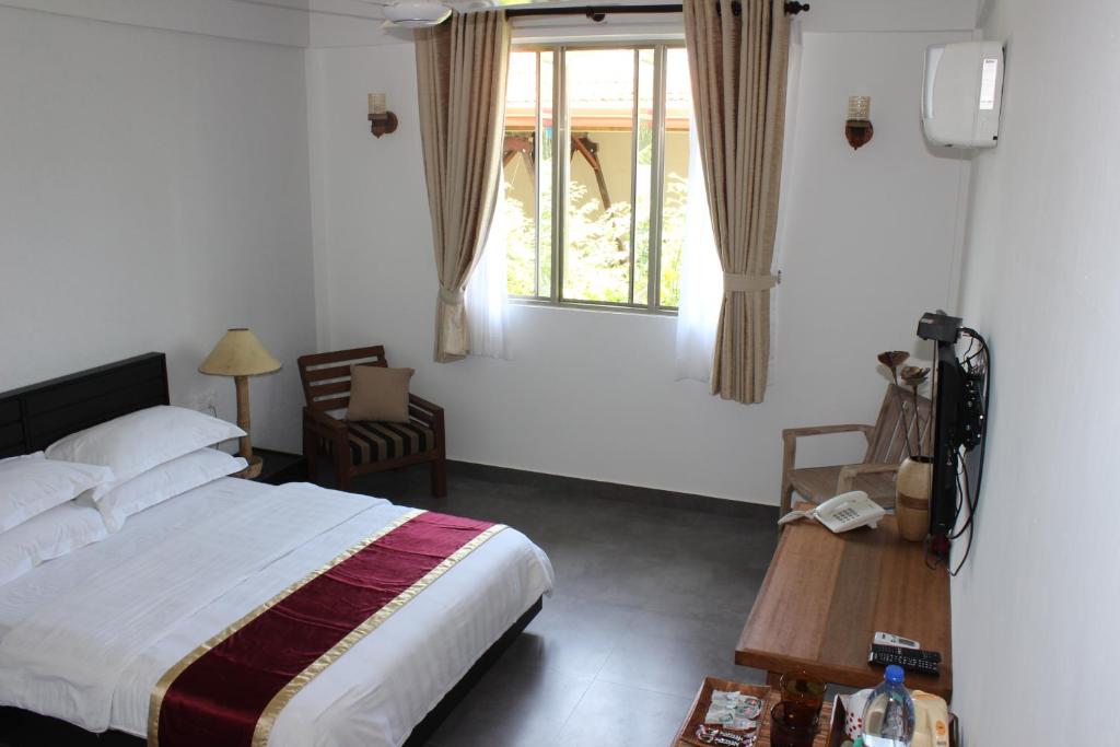 Двухместный (Двухместный номер Делюкс с 1 кроватью или 2 отдельными кроватями, вид на сад) гостевого дома Cerulean View Residence, Ханимаду
