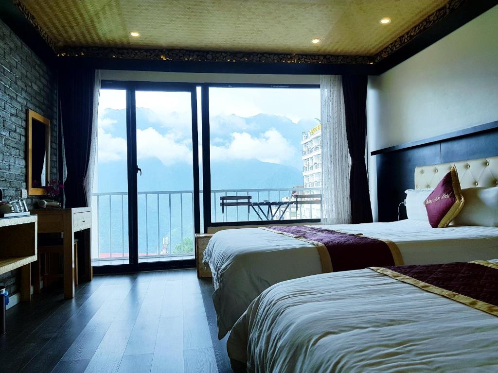 Двухместный (Двухместный номер Делюкс с 2 отдельными кроватями и видом на горы) отеля Phuong Nam Hotel with mountain view, Сапа