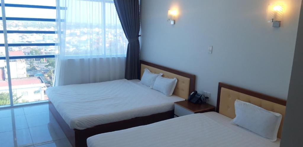 Трехместный (Трехместный номер с окном) отеля Sao Kim, Камау