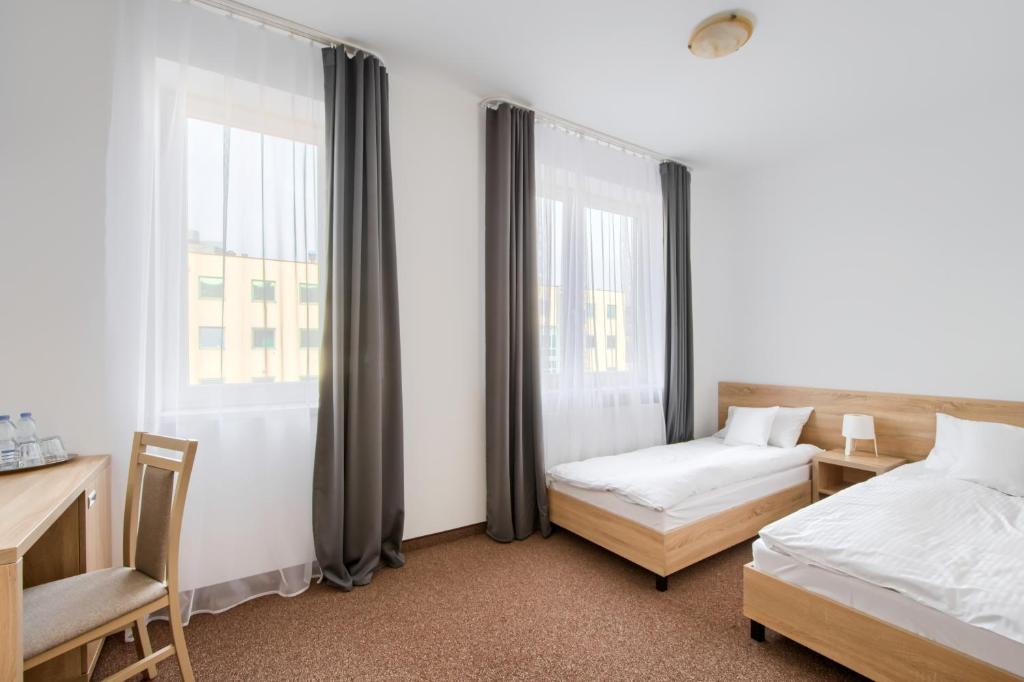 Двухместный (Улучшенный двухместный номер с 2 отдельными кроватями) отеля Patra, Варшава