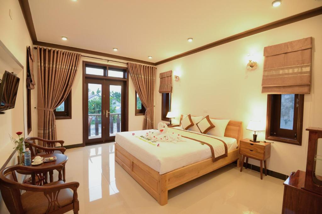 Двухместный (Двухместный номер Делюкс с 1 кроватью или 2 отдельными кроватями и видом на бассейн) виллы Cam Thanh Village Villas, Хойан