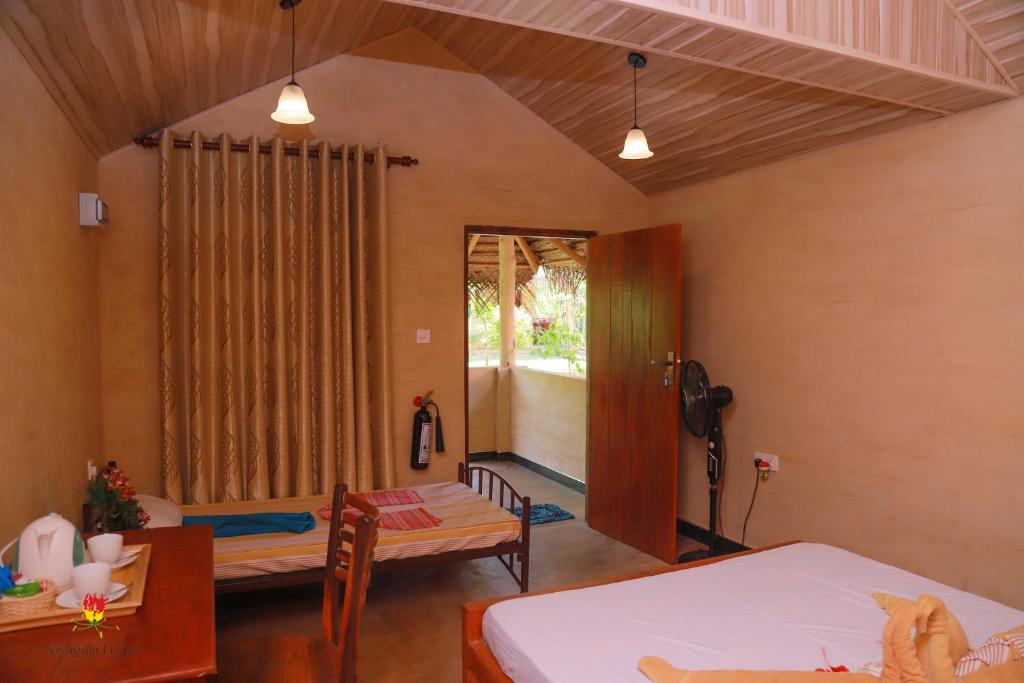 Трехместный (Трехместный номер) отеля Niyagala Lodge Sigiriya, Сигирия
