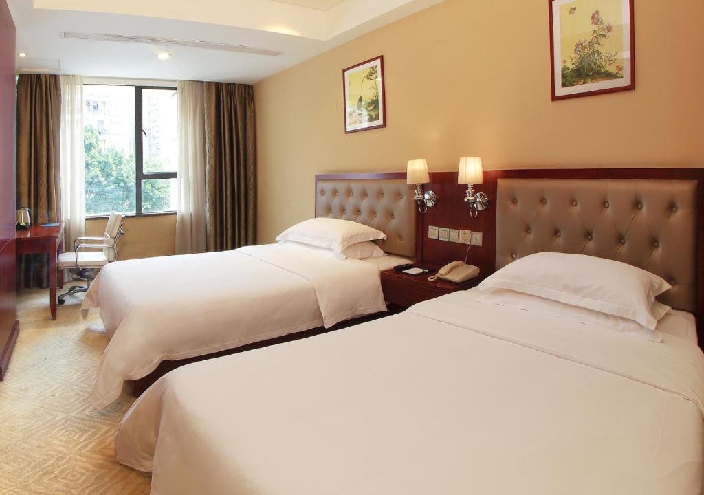 Двухместный (Улучшенный двухместный номер с 2 отдельными кроватями) отеля Wassim Hotel - Wanxin Hotel, Гуанчжоу