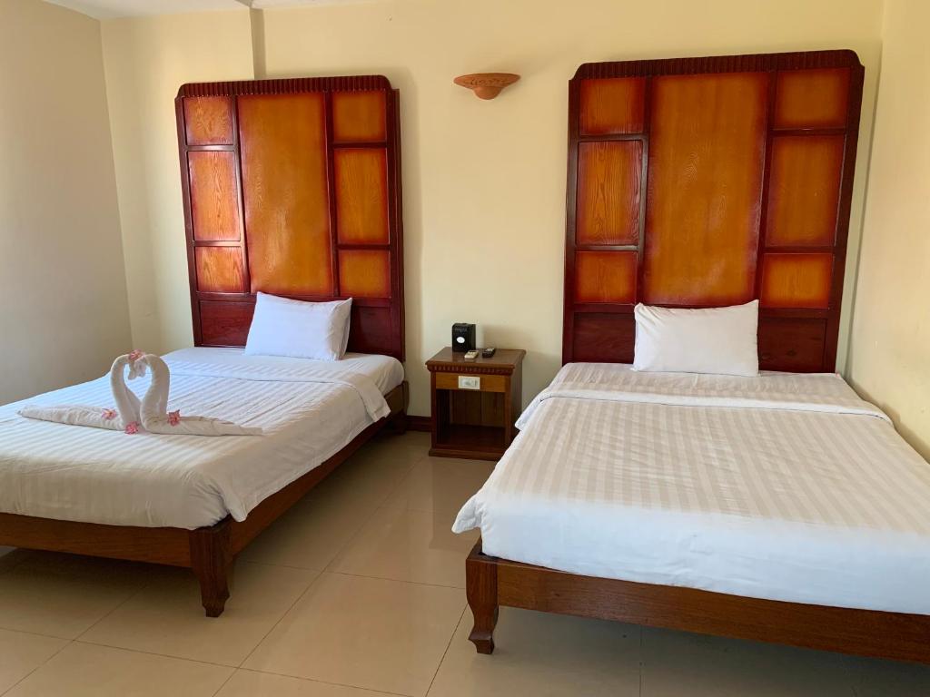 Двухместный (Улучшенный двухместный номер с 2 отдельными кроватями) отеля Champey Villa, Сием Рип