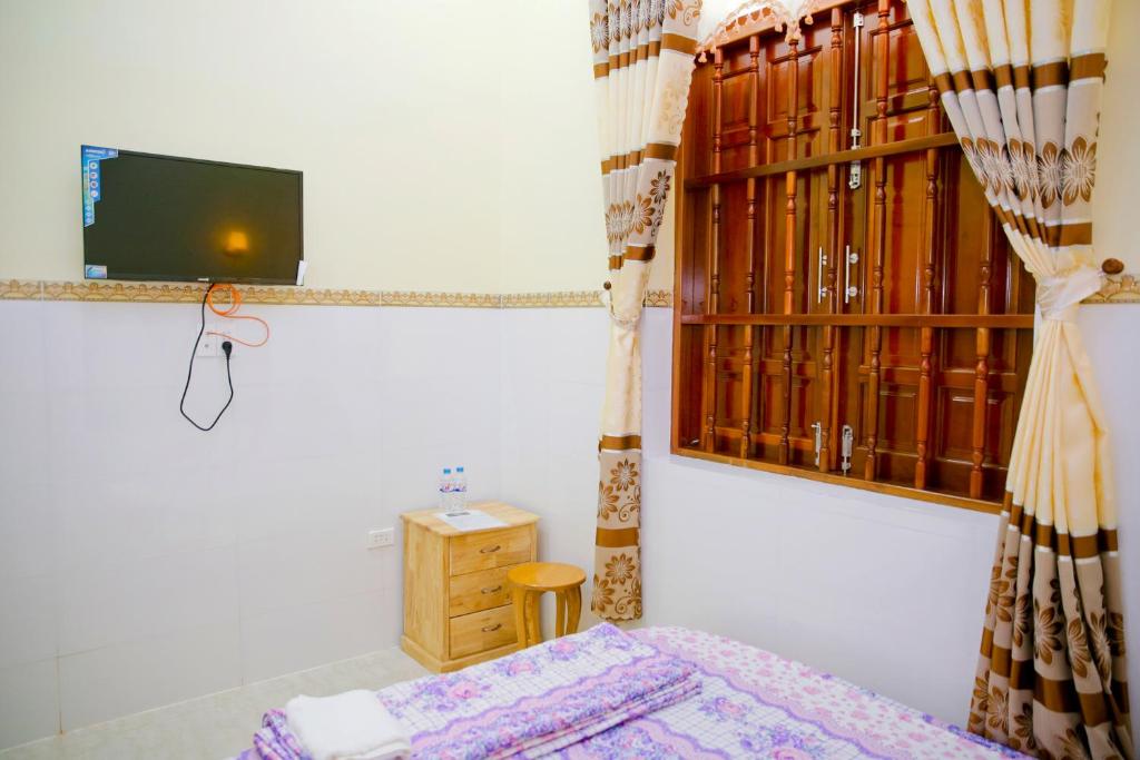 Четырехместный (Четырехместный номер с собственной ванной комнатой) апарт-отеля Nhà Nghỉ Quê Ló, Вунгтау