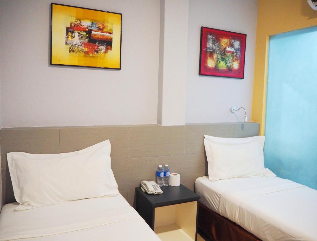 Двухместный (Стандартный двухместный номер с 2 отдельными кроватями) отеля Leo Leisure Hotel @ Central Market, Куала-Лумпур